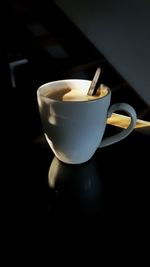 Close-up of coffee cup on table