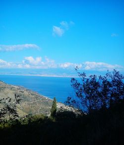 Scenic view of sea against blue sky