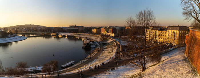 High angle view of bridge over river in city during winter