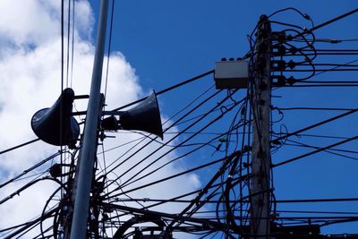 Low angle view of electricity pylon