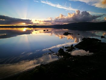 Scenic view of sea against sky at sunset