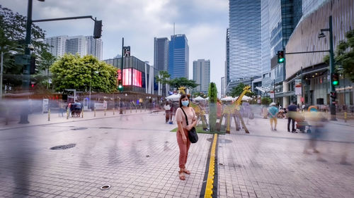 People walking on street in city