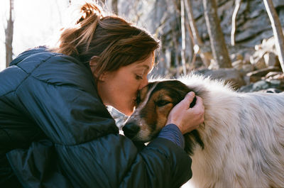 Close-up of couple with dog