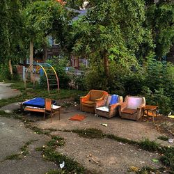 Empty chairs in yard