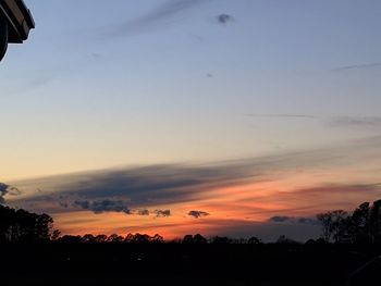 Scenic view of silhouette landscape against sky during sunset