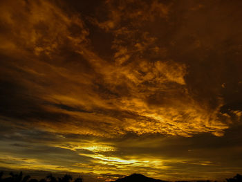 Low angle view of dramatic sky during sunset