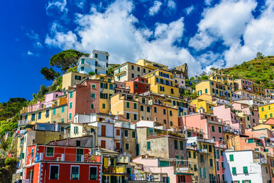 Low angle view of buildings against sky at riomaggiore