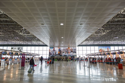 Group of people walking in modern building