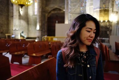 Beautiful young woman in church