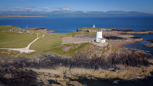 Scenic view of lighthouse and sea against sky