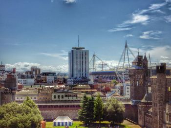 Buildings against cloudy sky