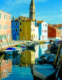 Boats moored at harbor