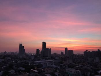 Cityscape against sky during sunset