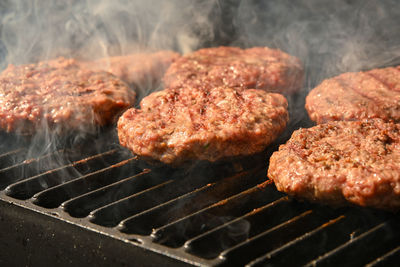 Close-up of meat on barbecue grill