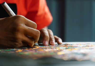 Close-up of man hand on table