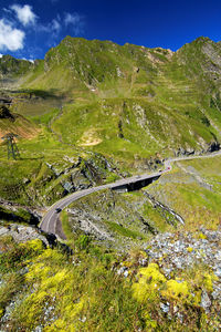 Scenic view of winding road through mountainous landscape