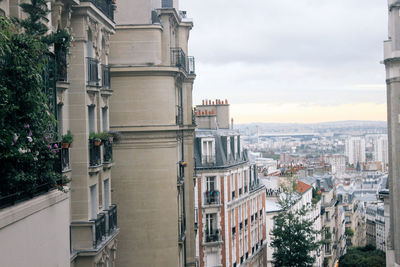 Aerial view of city against sky