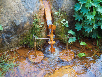 High angle view of water flowing through pipe