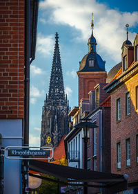 Low angle view of buildings against sky in city