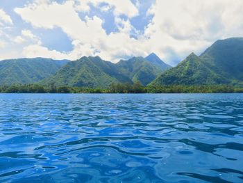 Scenic view of lake and mountains against sky