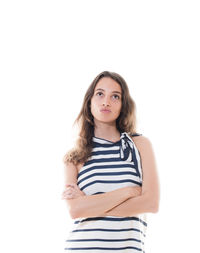 Portrait of beautiful young woman against white background