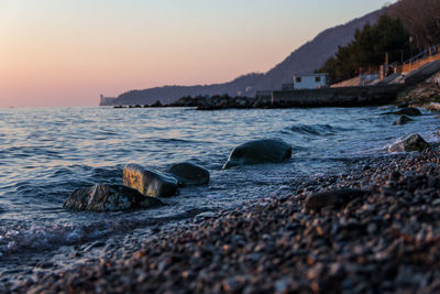 Scenic view of sea against sky at sunset