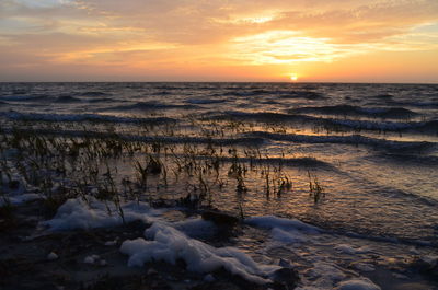 Scenic view of sea against sky during sunset