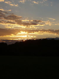 Silhouette of landscape against sunset