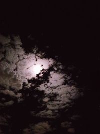 Low angle view of moon in sky at night