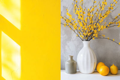 High angle view of yellow flowers on table