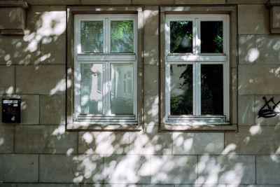 Reflection of building on glass window