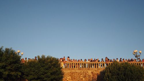 Panoramic shot of building against clear blue sky