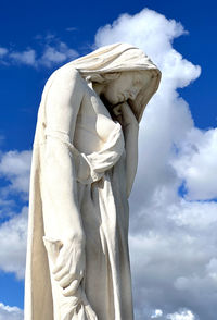 Low angle view of statue against sky