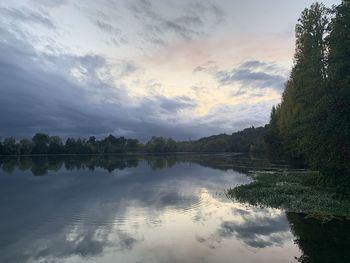 Scenic view of lake against sky during sunset