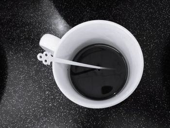 High angle view of coffee cup on table