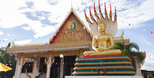 Low angle view of statue against temple