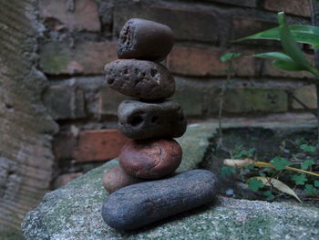 Stack of stones on stone wall