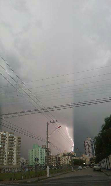 POWER LINES AGAINST CLOUDY SKY