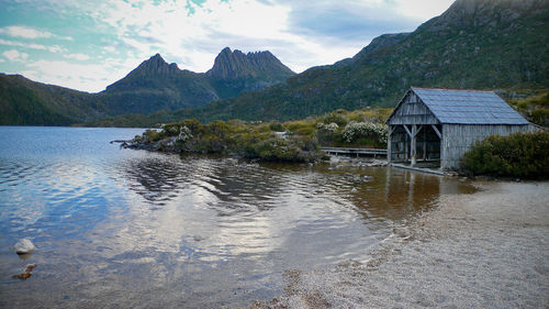 Scenic view of lake and mountains against sky