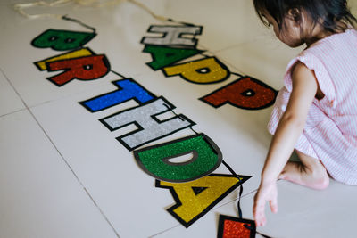 High angle view of girl with toy