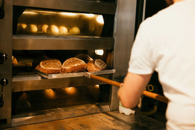 Midsection of man preparing food