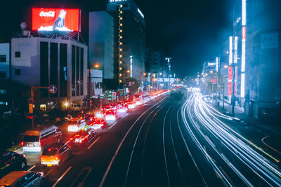 Light trails on road in city at night