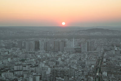 High angle view of city at sunset