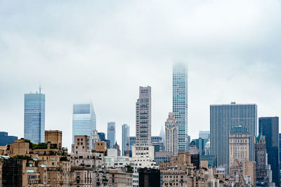 Modern buildings in city against sky