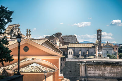 Ancient buildings in town during sunny day