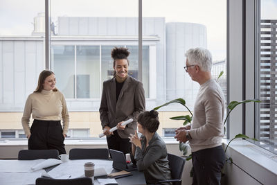 People having meeting in office