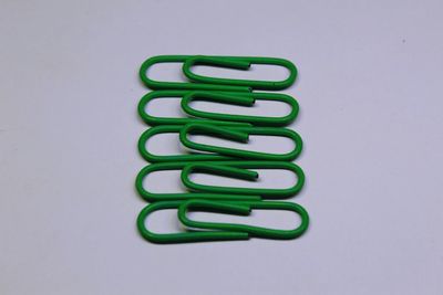 Close-up of colored pencils over white background