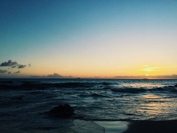 Scenic view of sea at sunset