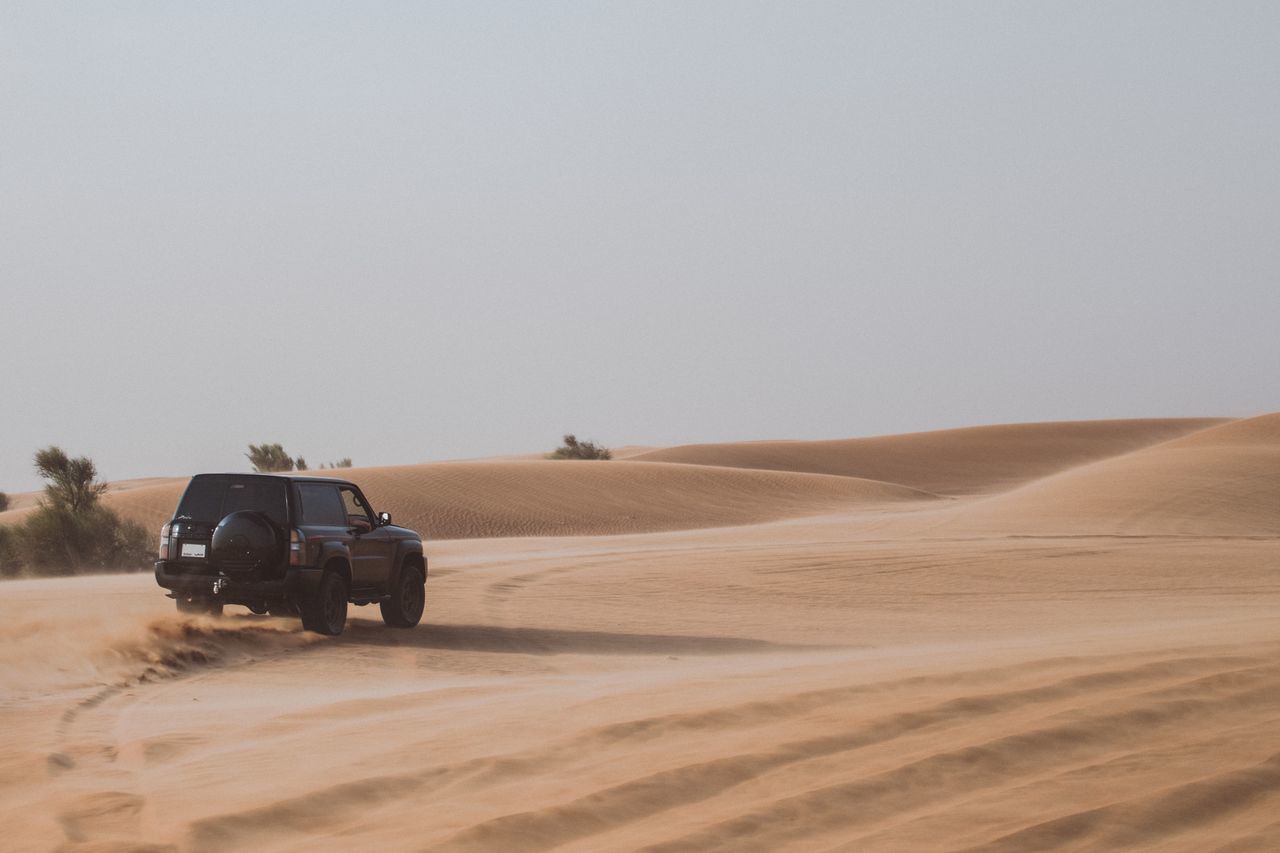 CAR ON DESERT LAND