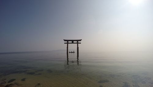 Lifeguard hut on beach against sky